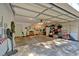 Spacious garage with storage, lighting and plenty of room for parking and projects at 30 Sweetwood Ct, Roswell, GA 30076