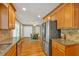 Beautiful kitchen featuring granite countertops, stainless steel appliances, and hardwood cabinets at 30 Sweetwood Ct, Roswell, GA 30076