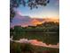 Beautiful lake and sunset view showcasing the community's scenic surroundings and natural beauty at 30 Sweetwood Ct, Roswell, GA 30076