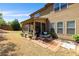 Backyard features a screened porch, patio, and grassy area with a wood fence at 4015 Two Bridge Ct, Buford, GA 30518