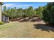 Spacious backyard with a lush lawn and tree-lined landscaping, perfect for outdoor activities at 4015 Two Bridge Ct, Buford, GA 30518