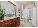 Well-lit bathroom with a double sink vanity, granite countertop, and a shower-tub combination at 4015 Two Bridge Ct, Buford, GA 30518