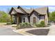 Inviting community clubhouse with stone facade and manicured landscaping, offering a welcoming atmosphere at 4015 Two Bridge Ct, Buford, GA 30518