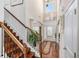 Bright foyer with hardwood floors, staircase, high ceilings, and natural light at 4015 Two Bridge Ct, Buford, GA 30518