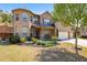 Inviting two-story brick home featuring a landscaped front yard and a three-car garage at 4015 Two Bridge Ct, Buford, GA 30518