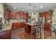 Spacious kitchen with an island, stainless steel appliances, and ample cabinet space for storage at 4015 Two Bridge Ct, Buford, GA 30518