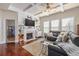 Comfortable living room with a fireplace, TV, and hardwood floors at 4015 Two Bridge Ct, Buford, GA 30518