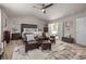 Well-appointed main bedroom with a sitting area, plush carpet, and ensuite bathroom access at 4015 Two Bridge Ct, Buford, GA 30518