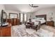 Spacious main bedroom with a king-sized bed, sitting area, and ample closet space at 4015 Two Bridge Ct, Buford, GA 30518