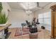 Bright office with a tray ceiling, large window, and neutral carpet at 4015 Two Bridge Ct, Buford, GA 30518