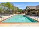 Community swimming pool, featuring clear blue water, mushroom fountain, and plenty of seating at 4015 Two Bridge Ct, Buford, GA 30518