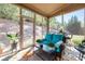 Cozy sunroom featuring comfortable furniture and serene views of the surrounding landscape at 4015 Two Bridge Ct, Buford, GA 30518