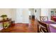 Warm dining room with hardwood floors, seamlessly connected to other living areas at 6884 Barker Station Walk, Sugar Hill, GA 30518