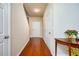 Welcoming hallway with hardwood floors and neutral walls, offering a bright and airy feel at 6884 Barker Station Walk, Sugar Hill, GA 30518