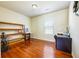 Bright office space with hardwood floors, shelving, and a large window at 6884 Barker Station Walk, Sugar Hill, GA 30518