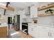 Open concept kitchen with stainless steel appliances and hardwood flooring with plenty of natural light at 1690 Cotswold Ne Dr, Brookhaven, GA 30319