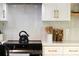 Well-designed kitchen featuring stainless steel appliances, stylish backsplash, and modern cabinetry at 1690 Cotswold Ne Dr, Brookhaven, GA 30319
