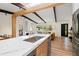 Modern kitchen island with sink, countertops, stylish faucet, and open-concept layout at 1690 Cotswold Ne Dr, Brookhaven, GA 30319