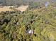 Wide aerial view of the property, illustrating its expansive surroundings, mature trees, and proximity to the river at 2167 W Wesley Nw Rd, Atlanta, GA 30327