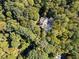Aerial view of a home nestled among lush trees, showcasing its secluded and private setting at 2167 W Wesley Nw Rd, Atlanta, GA 30327