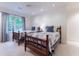 Bright bedroom featuring two beds with dark wood frames, side table and ample lighting at 2167 W Wesley Nw Rd, Atlanta, GA 30327