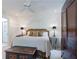 Stylized bedroom with a decorative headboard, and dark wood furniture, offering a restful ambiance at 2167 W Wesley Nw Rd, Atlanta, GA 30327