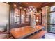 Bright dining space with a large table, bench seating, and a stylish light fixture at 2167 W Wesley Nw Rd, Atlanta, GA 30327