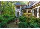 Charming front entrance with stone accents, manicured landscaping, and a tranquil bird bath at 2167 W Wesley Nw Rd, Atlanta, GA 30327