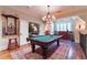 Game room features a pool table, chandelier, and a large decorative area rug at 2167 W Wesley Nw Rd, Atlanta, GA 30327