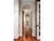 Hallway with hardwood floors, archways, and stone accents at 2167 W Wesley Nw Rd, Atlanta, GA 30327