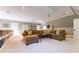 Cozy living room with a large sectional sofa, recessed lighting, and neutral decor at 2167 W Wesley Nw Rd, Atlanta, GA 30327
