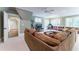 Spacious living area with a comfortable sofa, TV, and an adjacent office space at 2167 W Wesley Nw Rd, Atlanta, GA 30327