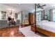 Spacious main bedroom boasting hardwood floors, sitting area with fireplace and a four poster bed at 2167 W Wesley Nw Rd, Atlanta, GA 30327