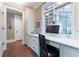 Office space with built-in desk, drawers, shelves and brick floors at 2167 W Wesley Nw Rd, Atlanta, GA 30327