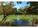 Scenic view of the serene river surrounded by lush trees at 2167 W Wesley Nw Rd, Atlanta, GA 30327