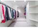 Well-organized walk-in closet with ample storage and shelving at 2167 W Wesley Nw Rd, Atlanta, GA 30327