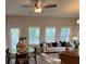 Inviting living room showcasing a dining area, a comfortable sofa, and natural light from several windows at 4284 Sw Notting Hill Dr # 20, Atlanta, GA 30331