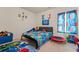 bedroom with a blue and red color scheme with posters and decorations, perfect for children at 550 Breton Highlands, Fairburn, GA 30213