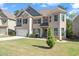 Charming two-story home with brick facade, well-manicured lawn, and a welcoming front entrance at 550 Breton Highlands, Fairburn, GA 30213