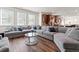 Spacious living room with a large sectional couch, hardwood floors, and plenty of natural light at 550 Breton Highlands, Fairburn, GA 30213