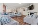 Open concept space with a fireplace, large sectional, and views of the kitchen at 550 Breton Highlands, Fairburn, GA 30213
