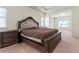 The main bedroom offers a bed and two nightstands. The room is illuminated by natural light at 550 Breton Highlands, Fairburn, GA 30213