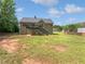 Spacious backyard with deck, patio, and partially grassy area at 10924 Hondal Ct, Hampton, GA 30228