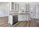 Kitchen with white cabinets, stainless steel appliances, and granite countertop at 10924 Hondal Ct, Hampton, GA 30228