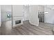 Spacious living room with a fireplace, hard surface floors, and lots of natural light at 10924 Hondal Ct, Hampton, GA 30228