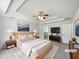Spacious main bedroom featuring tray ceilings and an ensuite bathroom at 10924 Hondal Ct, Hampton, GA 30228