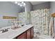 Bathroom featuring a double vanity and colorful shower curtain at 1622 Bunting Forest Ct, Marietta, GA 30064