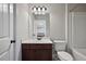 Neat bathroom featuring a modern vanity with a marble countertop and a toilet at 1622 Bunting Forest Ct, Marietta, GA 30064