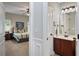 View of the bedroom and bathroom with carpet flooring and fan at 1622 Bunting Forest Ct, Marietta, GA 30064