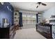 Bedroom showcasing custom decor, a ceiling fan, and a bright window at 1622 Bunting Forest Ct, Marietta, GA 30064